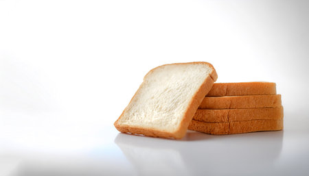 Delicious bread slices on side position provides copy space for text. background concept isolated light white backgroundの写真素材