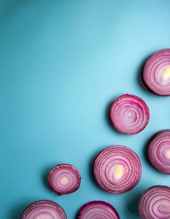 red onion slices. pattern texture on side position provides copy space for text. background concept isolated light blue backgroundの写真素材
