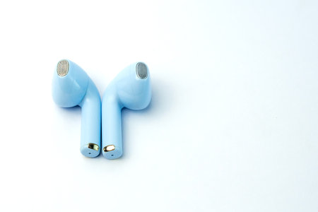 Modern blue wireless earbuds with ergonomic design and premium sound. Lightweight, compact, and ideal for music, calls, gaming, and workouts with noise isolation technology.の写真素材