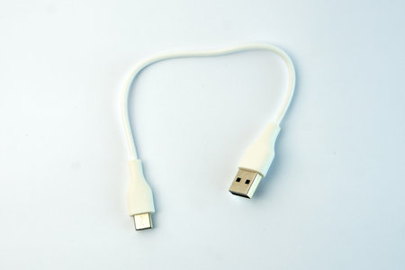 White USB to Micro USB cable for fast charging and data transfer. Compact and durable, ideal for...