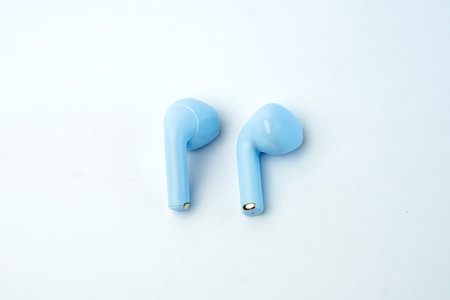 Elegant blue wireless earbuds with ergonomic fit and superior audio performance. Lightweight, compact, and perfect for music, calls, gaming, and workouts with noise reduction.の写真素材