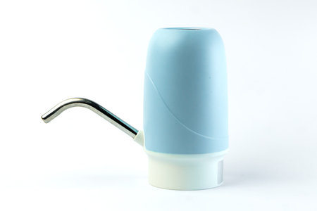 Portable electric water dispenser with a sleek blue and white design. Ideal for easy water dispensing from gallon bottles. Rechargeable, lightweight, and perfect for home or office use.の写真素材
