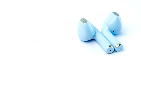 Trendy blue wireless earbuds with an ergonomic fit and superior sound quality. Lightweight and compact, ideal for music, calls, gaming, and workouts with noise isolation.の写真素材