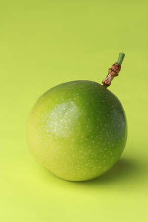 Isolated passion fruit on a green backgroundの写真素材
