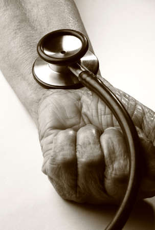 A stethoscope on an old hand
