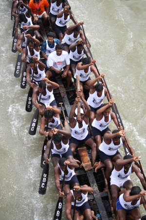 KOTTAYAM, INDIA - AUGUST 29, 2010 - Snake boat teams participate in the Thazhathangadi Boat race held in Kottayam, Kerala, India.のeditorial素材