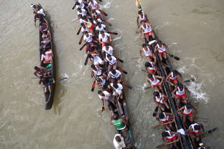 KOTTAYAM, INDIA - AUGUST 29, 2010 - Snake boat teams participate in the Thazhathangadi Boat race held in Kottayam, Kerala, India.のeditorial素材