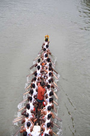 THIRUVALLA, INDIA - AUGUST 23 , 2010 - A Snake boat team participates in the Pumba Boat race held in...
