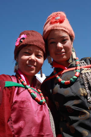 LEH, INDIA - SEPT 01 ,2012- Two unidentified Ladakhi tribal women wearing traditional dress pose as they participate in the cultural procession during Ladakh Festival  in Leh, India.のeditorial素材