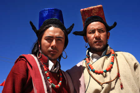 LEH, INDIA - SEPT 01 ,2012- Two unidentified Ladakhi tribal men wearing traditional costumes poses as they participate in a cultural procession during Ladakh Festival  in Leh, India.のeditorial素材