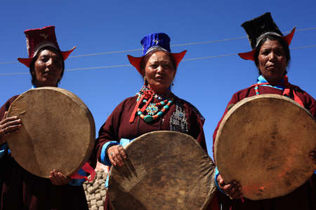 LEH, INDIA - SEPT 01 ,2012-Unidentified Ladakhi tribal women holding traditional drums participate in a cultural procession during Ladakh Festival  in Leh, India.のeditorial素材