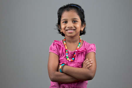 Portrait of little girl of Indian origin with a smiling faceの写真素材