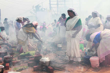 ATTUKAL, INDIA - MAR 7,2012-Unidentified devotees take part in the 'Pongala' ritual in Attukal,Kerala,India.The event is in Guinness records as the largest gathering of women in the worldのeditorial素材