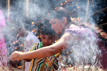 COLOMBO, SRI LANKA - DEC 11,2013- An unidentified Buddhist devotee burn incense sticks as a...