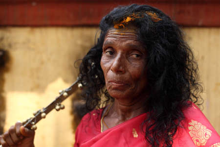 KODUNGALLUR, INDIA - APR 11,2013-An Oracle clad in red dress participates in the Bharani festival at Kodungallur Bhagavathi temple in Kodungallur, Kerala, Indiaのeditorial素材