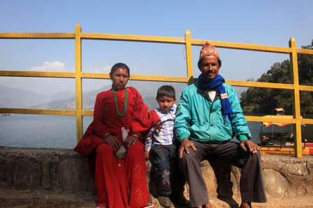 POKHARA, NEPAL - FEB 06,2014- An unidentified Nepalese family come for boating in Begnas Lake in Pokhara, Nepal. Pokhara is a tourist destination in Nepal for trekking and boating.のeditorial素材
