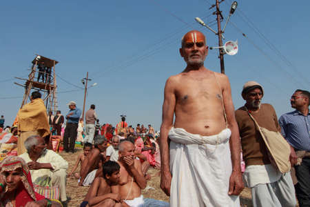 ALLAHABAD - FEB 09,2013-A Hindu devotee looks as he come to take holy bath at Kumbh Mela in...