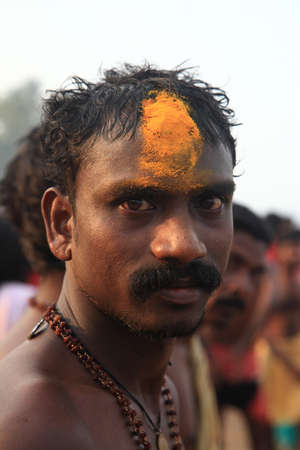 KODUNGALLUR, INDIA - APR 11,2013-An Oracle with turmeric paste applied to his bruised forehead participates in theBharani festival at Bhagavathi temple  in Kodungallur, Kerala, Indiaのeditorial素材