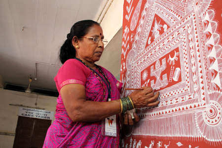 KOTTAYAM, INDIA - MAY 21,2013-Mural artist Manki Bapu paints on the wall during the International Mural painters camp organized by Cultural Department of Kerala in Kottayam, India.のeditorial素材