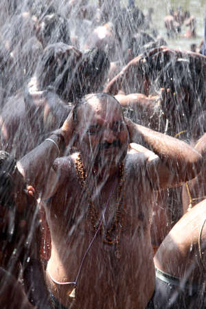 ERUMELI, INDIA - DEC 15,2014-Unidentified devotees of Lord Ayyappa take bath in shower during their...