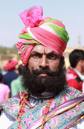 JAISALMER, INDIA - FEB 01,2015-Unidentified traditionally dressed Rajasthani man with long mustache and beard participates in the Desert Festival held in Jaisalmer, Rajasthan, India.のeditorial素材
