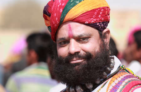 JAISALMER, INDIA - FEB 01,2015-Unidentified traditionally dressed Rajasthani man with long mustache and beard participates in the Desert Festival held in Jaisalmer, Rajasthan, India.のeditorial素材