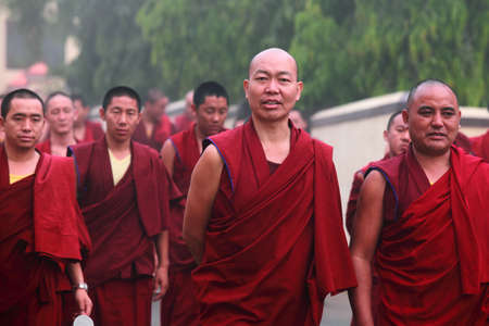 BYLAKUPPE, INDIA - MAR 29, 2015-Unidentified Buddhist monks walk in group for morning prayer in Bylakuppe, India. Bylakuppe is second largest Tibetan refugee settlements in India.のeditorial素材