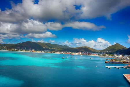 Sweeping white beach with blue sky and seaの写真素材