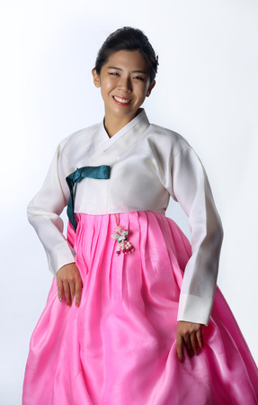 Asian woman wearing traditional korean hanbok with white  background.の写真素材