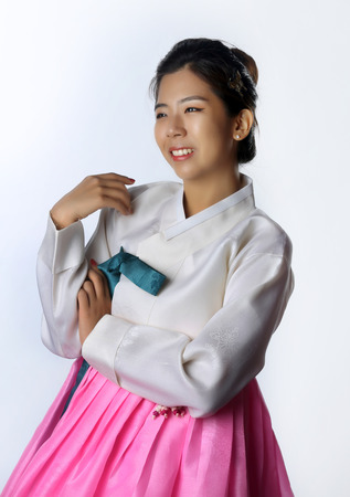 Korean Woman with Hanbok, the traditional Korean dress in white background with clipping path.の写真素材