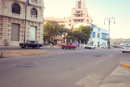 American classic cars, vintage taxies carrying tourists and visitors on Paseo de Marti in Havana, Cubaのeditorial素材
