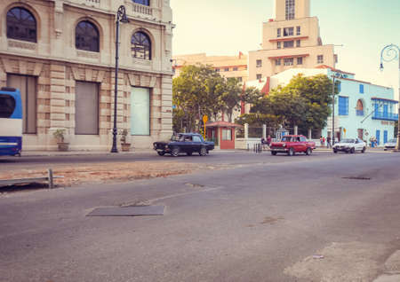 American classic cars, vintage taxies carrying tourists and visitors on Paseo de Marti in Havana, Cubaのeditorial素材