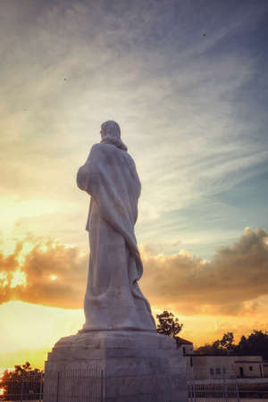 Statue of the Virgin Mary at sunset in Rome, Italy.の写真素材