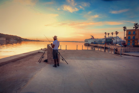People are fishing at the Malecon Road road in the city of Havana on Cuba in the caribbean sea....