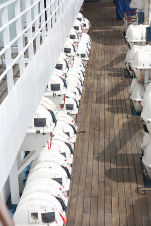 Rear view of row of motor boatsof cruise ship
