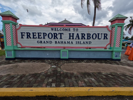 FREEPORT, GRAND BAHAMA ISLAND - APRIL 29, 2022: A sign welcomes tourists to the Freeport Harbor on Grand Bahama Island.のeditorial素材