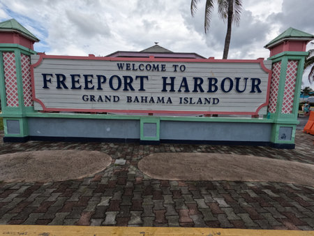 FREEPORT, GRAND BAHAMA ISLAND - APRIL 29, 2022: A sign welcomes tourists to the Freeport Harbor on Grand Bahama Island.のeditorial素材