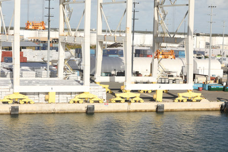 The port canaveral with big containerships and cranes, in the back the skyline.のeditorial素材