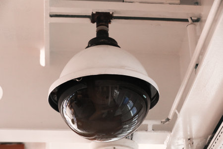 Surveillance cameras and a loudspeaker on the bulkhead of the ship's hull.