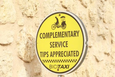 complementary taxi services sign Bicycle rickshaw transferring guests from cruise ship terminal...