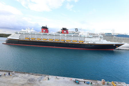 the Disney Magic, a Disney Cruise Line ship, docks in nassau , The cruise ship is 984 feet long and can accommodate up to 2400 passengers.のeditorial素材