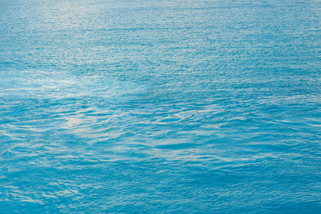 Background shot of aqua sea water surfaceの写真素材