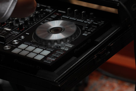 Close up of Hand Increasing Sound of DJ Instrument, Moving Fader