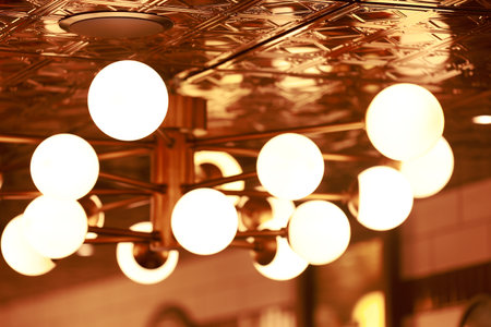 The light bulb is mounted on the ceiling.