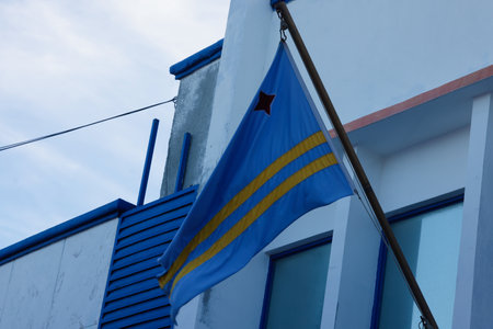 Aruba flag and blue sky with clouds.の写真素材