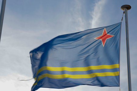 Aruba flag and blue sky with clouds.の写真素材