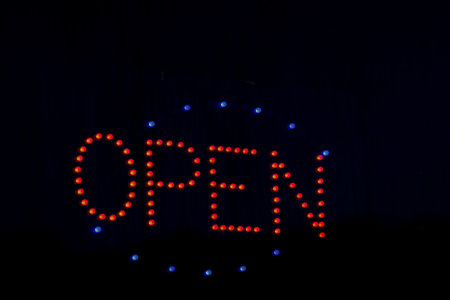 Open. Neon sign on the door.