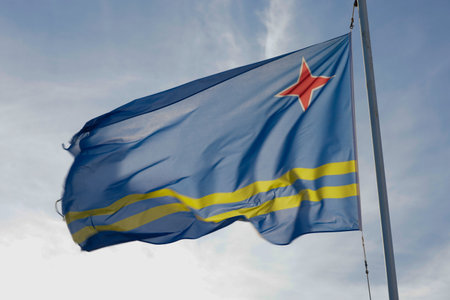 Aruba flag and blue sky with clouds.の写真素材