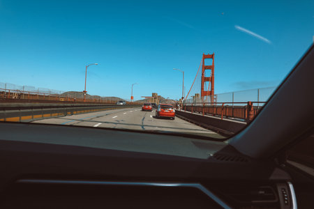 View from inside the car of golden gate bridge on sunny day, san francisco bay and Pacific Ocean, California.の写真素材
