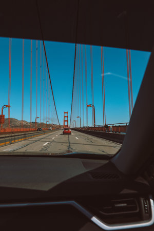 View from inside the car of golden gate bridge on sunny day, san francisco bay and Pacific Ocean, California.の写真素材
